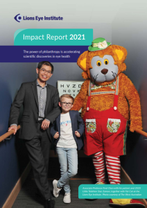 Image shows the cover of the 2021 Impact Report featuring Associate Professor Fred Chen with patient Eamon Doak and Fat Cat..