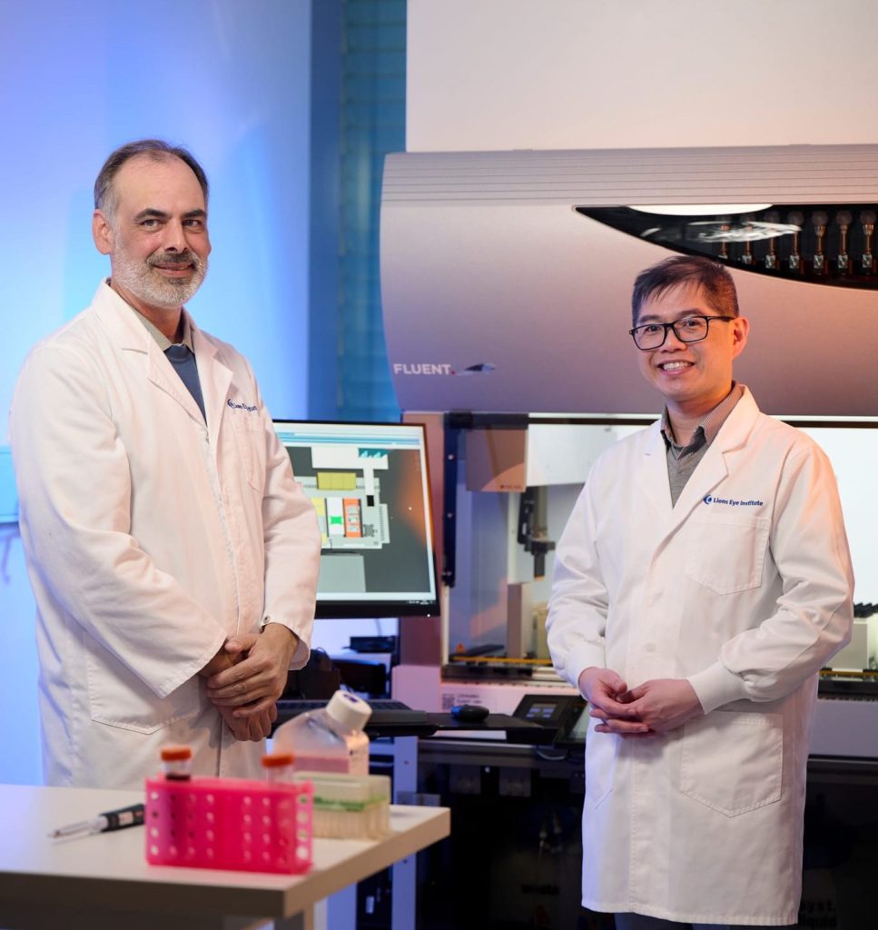 Dr Samuel McLenachan and Associate Professor Fred Chen with the stem cell robot