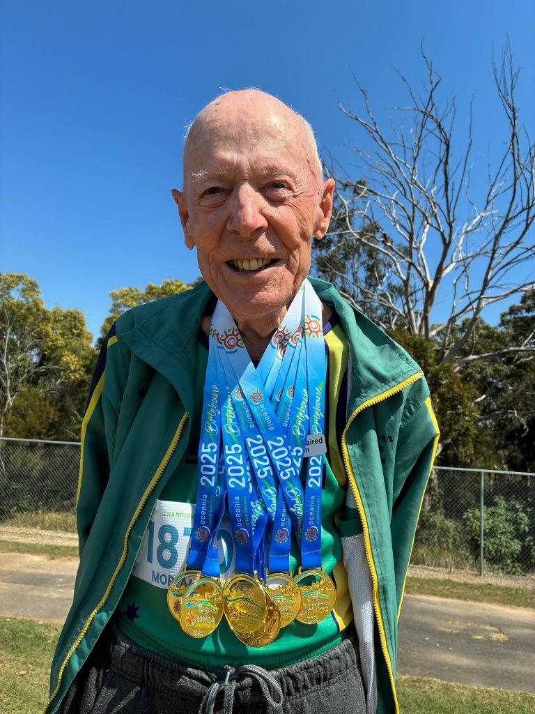 Morland at age 87 with his seven medals from the Oceania Masters Athletics Competition in Brisbane in September 2025